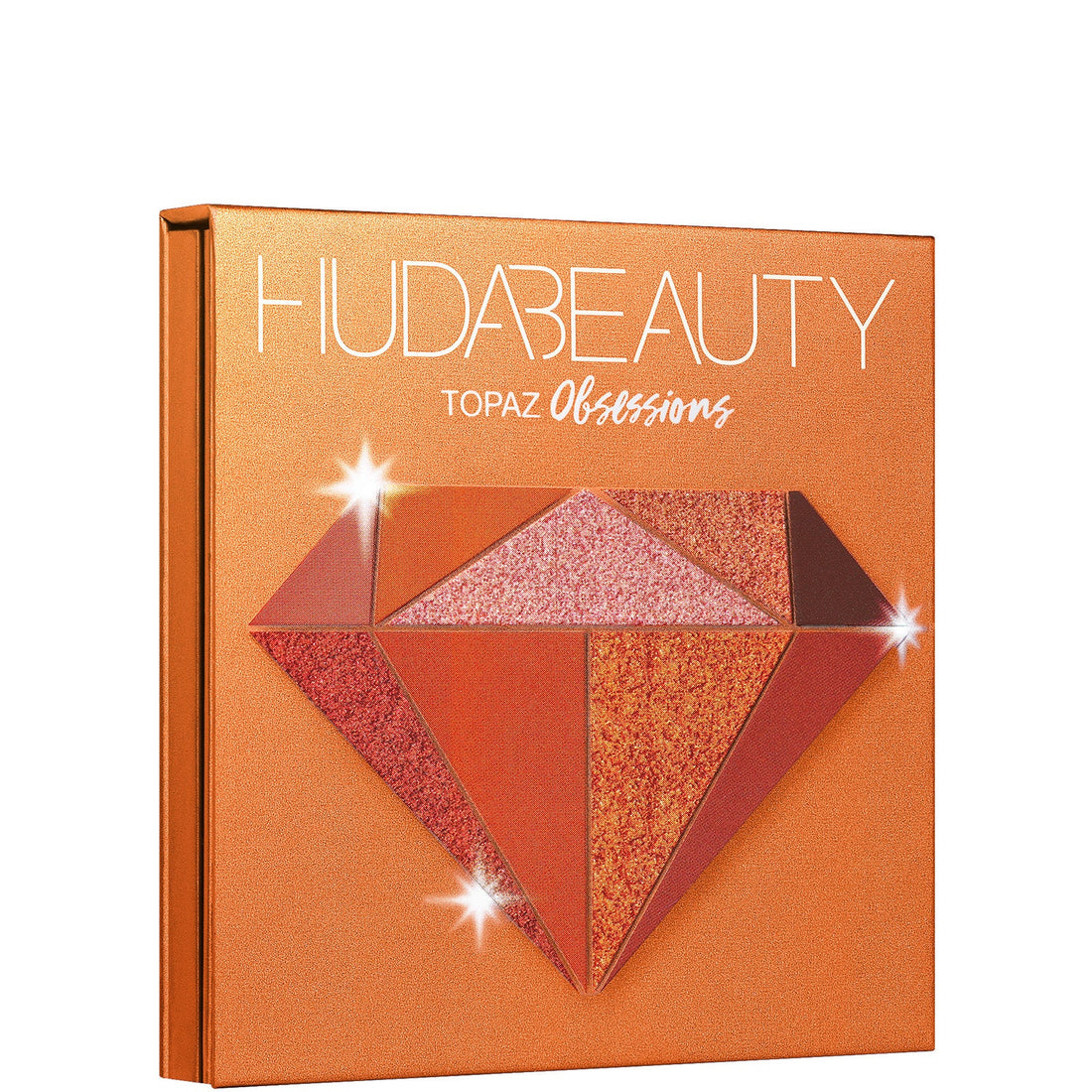 Huda Beauty Topaz Obsessions Palette swatch de tonos ámbar y bronce en piel